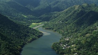 4.8K aerial stock footage of Houses on the shore of a lake among lush green forests, Lago Dos Bocas, Karst Forest Aerial Stock Footage | AX101_072