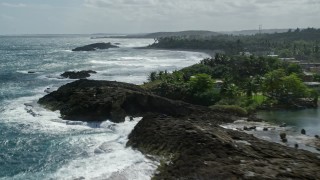 4.8K aerial stock footage of crystal blue waters and oceanfront property, Barceloneta, Puerto Rico Aerial Stock Footage | AX101_180E