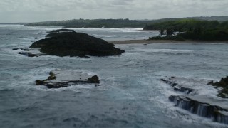 4.8K aerial stock footage Flying over clear waters and beach along the coast, Manati, Puerto Rico Aerial Stock Footage | AX101_186