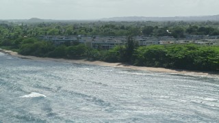 AX101_200 - 4.8K aerial stock footage of Condominiums adjacent to the beach, Vega Baja, Puerto Rico 