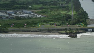 4.8K aerial stock footage of Flags displayed along Highway 165, Toa Baja, Puerto Rico Aerial Stock Footage | AX101_231