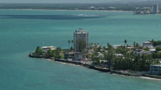 4.8K aerial stock footage of oceanfront homes and track kite surfer over pristine blue water, San Juan, Puerto Rico Aerial Stock Footage | AX102_007