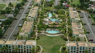 AX102_036E - 4.8K aerial stock footage of vacation rentals along the coast, Loiza, Puerto Rico