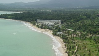 4.8K aerial stock footage of Turquoise waters and beachside condominiums, Rio Grande, Puerto Rico Aerial Stock Footage | AX102_038