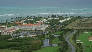 4.8K aerial stock footage of a golf resort along clear turquoise waters, Gran Melia Golf Resort, Puerto Rico Aerial Stock Footage | AX102_041E