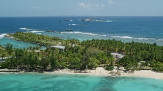 4.8K aerial stock footage flying over tropical blue waters toward a small island, Puerto Rico Aerial Stock Footage | AX102_082E