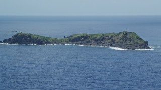 4.8K aerial stock footage of a Small rocky green island in sapphire blue waters, Culebra, Puerto Rico  Aerial Stock Footage | AX102_104