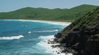 4.8K aerial stock footage fly over sapphire blue waters, reveal a Caribbean beach and lush vegetation, Culebra, Puerto Rico Aerial Stock Footage | AX102_115E