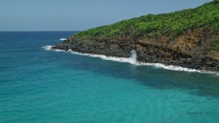 4.8K aerial stock footage of Sapphire blue waters against a rocky coast, Culebra, Puerto Rico Aerial Stock Footage | AX102_119