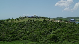 AX102_135 - 4.8K aerial stock footage of a Hilltop home with sapphire blue ocean views, Culebra, Puerto Rico 