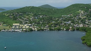 AX102_143E - 4.8K aerial stock footage of a factory in a coastal community, Culebra, Puerto Rico