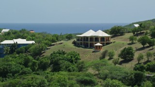 4.8K aerial stock footage of a Hilltop home with ocean views, Culebra, Puerto Rico Aerial Stock Footage | AX102_154