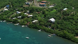 4.8K aerial stock footage of oceanfront homes overlooking sapphire waters, Culebra, Puerto Rico Aerial Stock Footage | AX102_155E