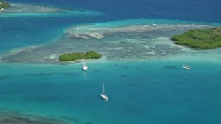 4.8K aerial stock footage of a Fishing boat near a reef in turquoise waters, Culebra, Puerto Rico Aerial Stock Footage | AX102_172