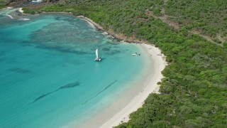 4.8K aerial stock footage of Boats in turquoise blue water along a white sand beach, Culebrita, Puerto Rico  Aerial Stock Footage | AX102_180