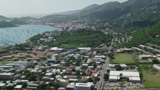 AX102_213 - 4.8K aerial stock footage Looking out on a coastal town from the hills, Charlotte Amalie, St. Thomas 