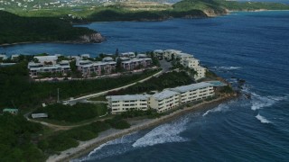 4.8K aerial stock footage of oceanfront condominiums on sapphire blue waters, Southside, St Thomas Aerial Stock Footage | AX102_235E