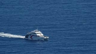 4.8K aerial stock footage of a Catamaran in blue ocean waters, Southside, St Thomas  Aerial Stock Footage | AX102_237