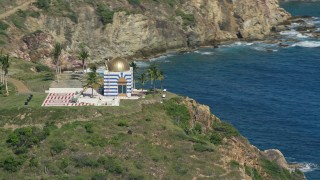 AX102_250 - 4.8K aerial stock footage of an Oceanfront gold domed building, Little St James Island