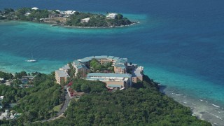 AX102_258 - 4.8K aerial stock footage of Sugar Bay Resort and Spa along turquoise blue waters, St Thomas