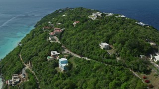 4.8K aerial stock footage of upscale, oceanfront hillside homes above turquoise Caribbean waters, Magens Bay, St Thomas Aerial Stock Footage | AX102_274E