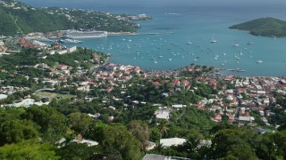 AX102_294E - 4.8K aerial stock footage reveal coastal town and Caribbean blue waters, Northside, Charlotte Amalie