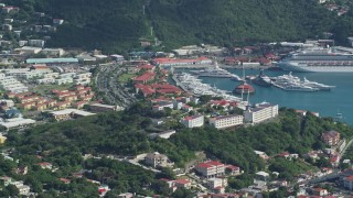 4.8K aerial stock footage of a Coastal town, cruise ship and yachts in Caribbean blue waters, Charlotte Amalie, St Thomas Aerial Stock Footage | AX102_302