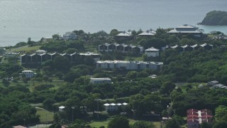 4.8K aerial stock footage of University of the Virgin Islands with a view of Caribbean waters, St Thomas Aerial Stock Footage | AX102_305