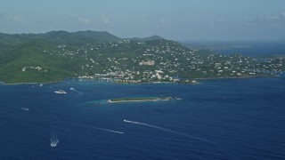 4.8K aerial stock footage of a Coastal town on a hillside and blue Caribbean waters, Cruz Bay, St John Aerial Stock Footage | AX103_016