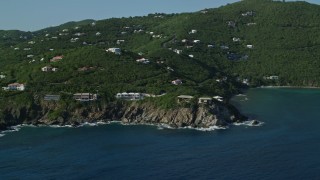 4.8K aerial stock footage of Hillside mansions overlooking Caribbean blue waters, Cruz Bay, St John Aerial Stock Footage | AX103_037