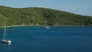 4.8K aerial stock footage of Sailboats its the blue waters of Great Lameshur Bay, St John Aerial Stock Footage | AX103_055