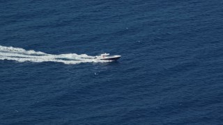 4.8K aerial stock footage of a Fishing boat in sapphire blue Caribbean waters, St Thomas Aerial Stock Footage | AX103_067