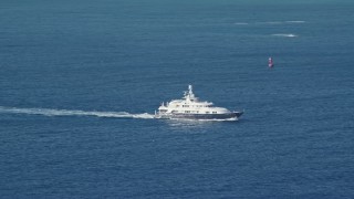 4.8K aerial stock footage of a Yacht in sapphire blue Caribbean waters off the coast, St Thomas Aerial Stock Footage | AX103_068