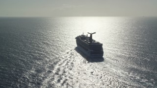 4.8K aerial stock footage of a Carnival cruise ship in Caribbean blue waters, St Thomas Aerial Stock Footage | AX103_069