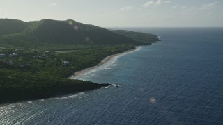 4.8K aerial stock footage of Caribbean beach alongside jungle and sapphire blue waters, Culebra, Puerto Rico Aerial Stock Footage | AX103_094