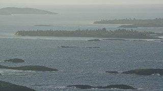 4.8K aerial stock footage of a small tree-covered Caribbean island off the coast, Puerto Rico Aerial Stock Footage | AX103_111E