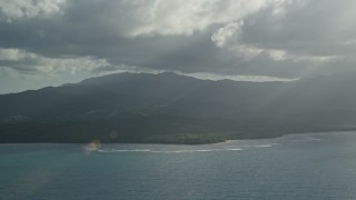 AX103_119 - 4.8K aerial stock footage of Caribbean blue waters and jungle, Luquillo, Puerto Rico