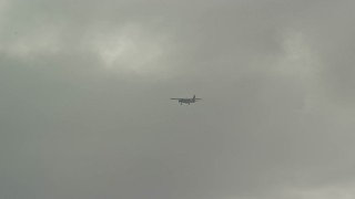 AX103_121 - 4.8K aerial stock footage Tracking civilian airplane against the clouds, Luquillo, Puerto Rico