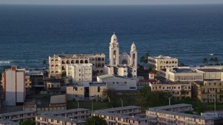 AX104_002 - 4.8K aerial stock footage of Iglesia San Agustín, Old San Juan, sunset