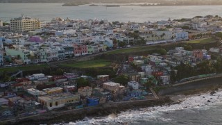 4.8K aerial stock footage of Oceanfront Caribbean homes, Old San Juan, Puerto Rico, sunset Aerial Stock Footage | AX104_003