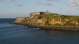 4.8K aerial stock footage of Fort San Felipe del Morro, Old San Juan, sunset Aerial Stock Footage | AX104_009E