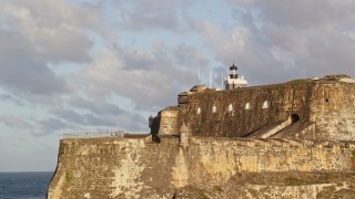 4.8K aerial stock footage of Fort San Felipe del Morro, Old San Juan, sunset Aerial Stock Footage | AX104_012