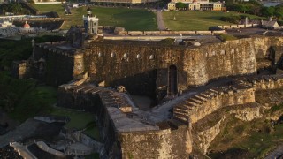 4.8K aerial stock footage of Fort San Felipe del Morro and lighthouse, Old San Juan, sunset Aerial Stock Footage | AX104_019E