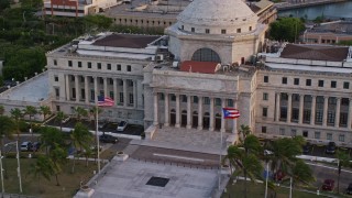 4.8K aerial stock footage tilting down on San Juan Capitol Building, Old San Juan, Puerto Rico, sunset Aerial Stock Footage | AX104_051E