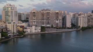 4.8K aerial stock footage of Hotels along Caribbean blue waters, San Juan, Puerto Rico sunset Aerial Stock Footage | AX104_061