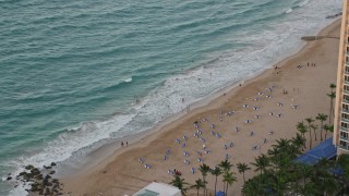 4.8K aerial stock footage of a Caribbean beach and turquoise waters, San Juan, Puerto Rico, sunset Aerial Stock Footage | AX104_063E