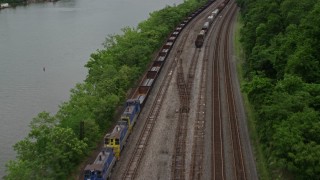 AX105_050E - 4.8K aerial stock footage revealing U.S. Steel Mon Valley Works, Braddock, Pennsylvania