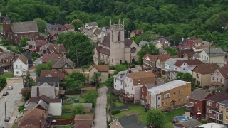 4.8K aerial stock footage of a Church and Suburban Homes, East Pittsburgh, Pennsylvania Aerial Stock Footage | AX105_064E