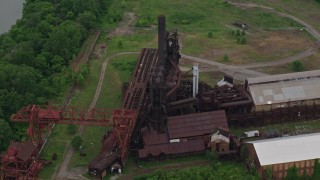 4.8K aerial stock footage approaching Carrie Furnace Steel Factory, Pittsburgh, Pennsylvania Aerial Stock Footage | AX105_071E