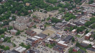 4.8K aerial stock footage of homes, apartment buildings, school and small hospital, Pittsburgh, Pennsylvania Aerial Stock Footage | AX105_083E